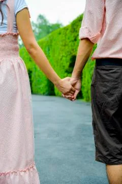 Hold hands of the couple Stock Photos
