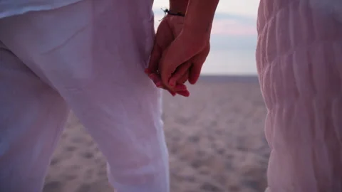 The Hold Of Hands Of Two Lovers At The Beach Stock Footage 301928817