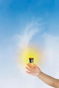 Hold on light blub on sky background Stock Photos