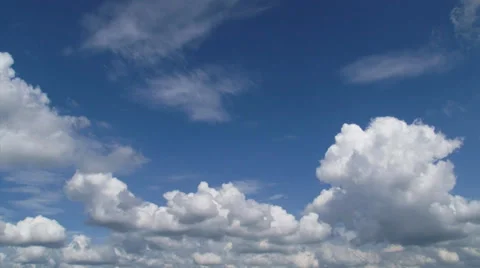 Hold + pan Cumulus clouds in blue sky Stock Footage 33817436