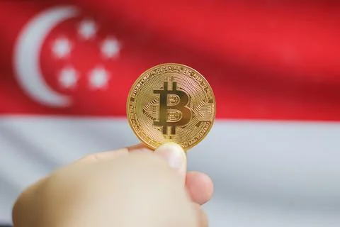 Hold the physical version of Bitcoin (the new virtual currency) and the Sin.. Stock Photos