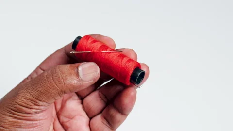 Hold Red Thread And Needle Stock Footage 248702693