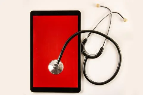 Hold the stethoscope on your tablet. Foto stock