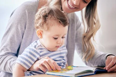 Hold on to the tiny moments because they grow up so fast. a mom reading to her Photos