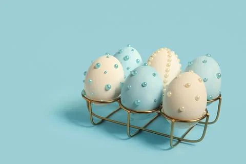 Holder and Easter eggs decorated with pearls on blue background Stock Photos