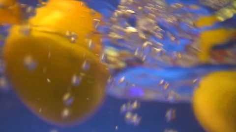 Holding Apple hands, Close-Up, Autumn Fruit. To wash an Apple in water. Dip a Stock Footage 102469799