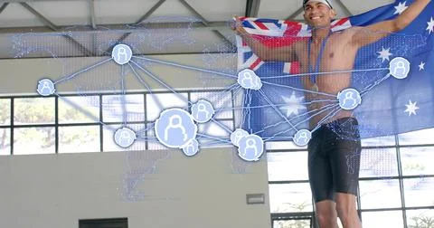 Holding Aussie flag, swimmer posing inside pool, wearing cap medal jammers wi Photos