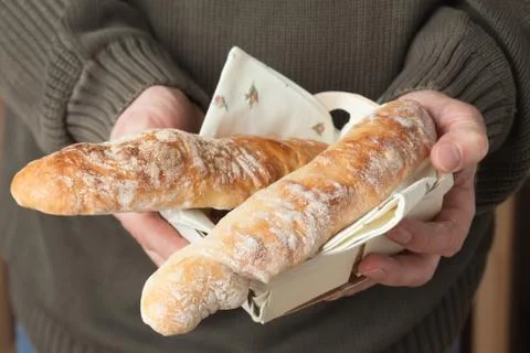 Holding baguettes Stock Photos