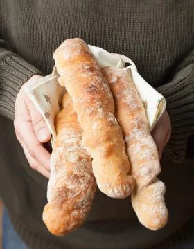 Holding baguettes Stock Photos