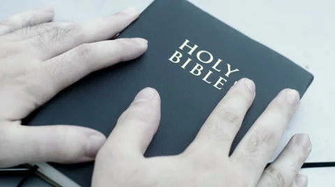 Holding bible book in hand Video stock 53463665