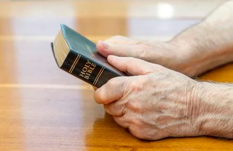Holding the bible Фото
