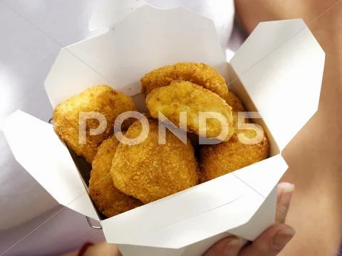 Holding A Box Of Chicken Nuggets