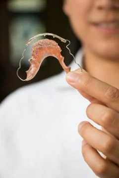 Holding braces for teeth Stock Photos