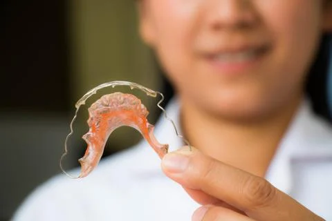 Holding braces for teeth Foto stock