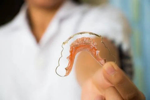 Holding braces for teeth Stock Photos