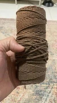 Holding the brown Macrame Single Strand Cotton Cord Stock Photos