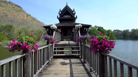 Holding the camera, walking forward to enter the wooden house Stock Footage 101385948