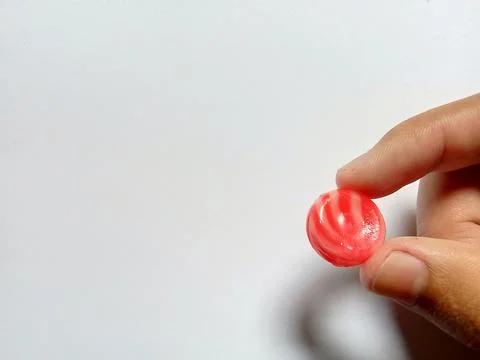 Holding candy Фото