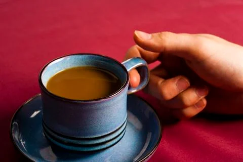 Holding coffee Stock Photos