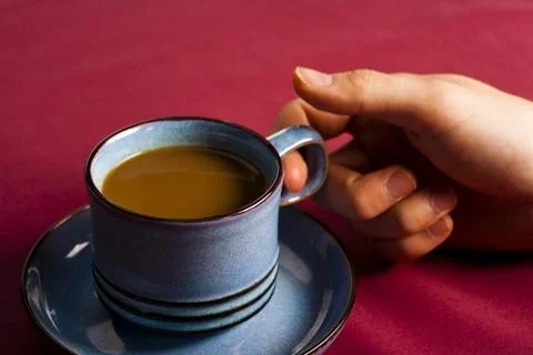 Holding coffee Stock Photos