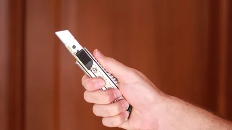 Holding construction knife closeup Stock Footage 95031710