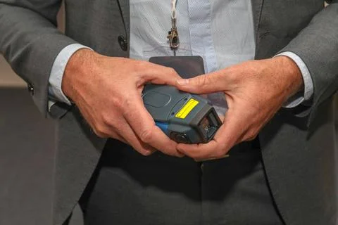 Holding Control Unit Man in Suit Holding Voice Collect Wireless Device Con... Stock Photos