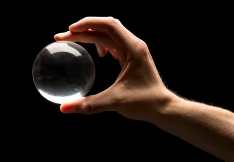 Holding a crystal ball Stock Photos
