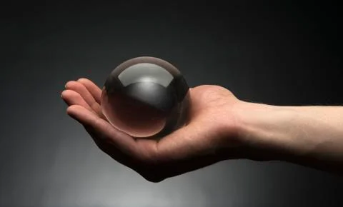 Holding a crystal ball Stock Photos