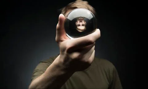 Holding a crystal ball Stock Photos