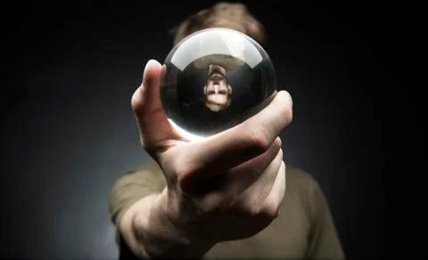 Holding a crystal ball Stock Photos