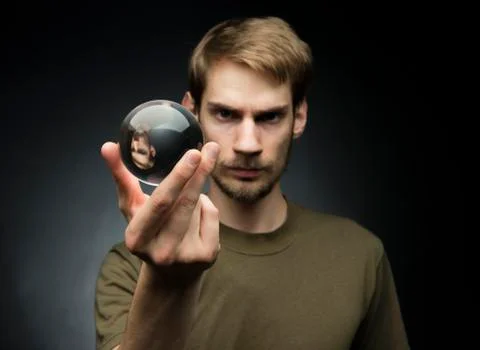 Holding a crystal ball Stock Photos