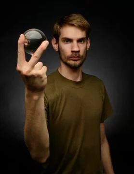 Holding a crystal ball Stock Photos