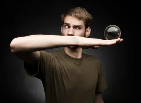 Holding a crystal ball Foto stock