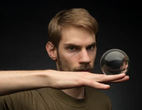 Holding a crystal ball Stock Photos