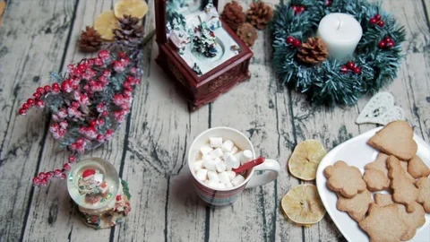 Holding a cup of coffee, eating marshmallows Stock-Footage 75386052