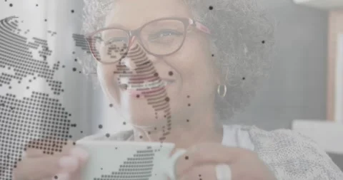Holding cup with digital code and world map animation, person smiling Stock Footage 325837167