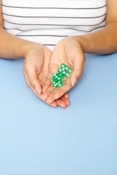 Holding dice Stock Photos