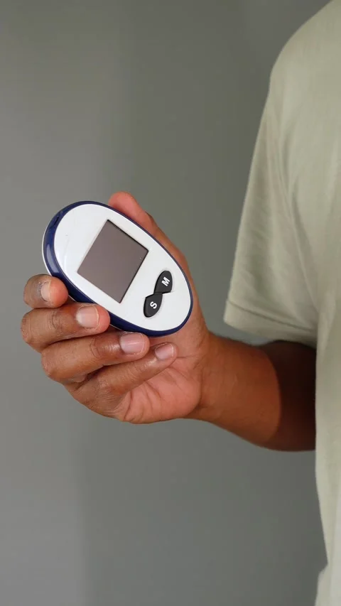Holding a digital measurement device for accurate readings Stock Footage 316999542