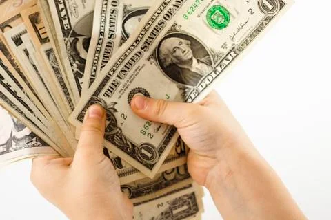 Holding dollars Stock Photos