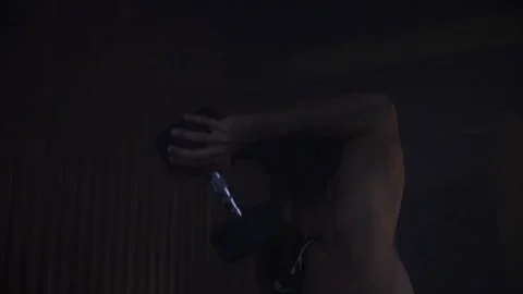 Holding dumbbell with both hands working on triceps Stock Footage 247284950