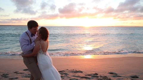 Holding Each Other Next To The Ocean At Sunset Stock-Footage 115325558