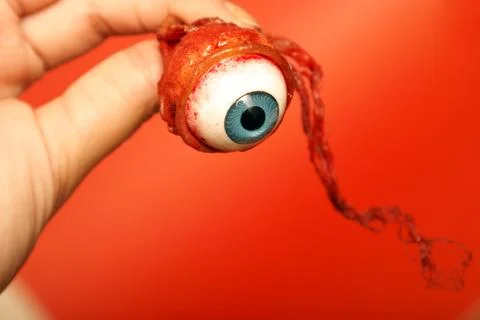 Holding an Eyeball Foto stock