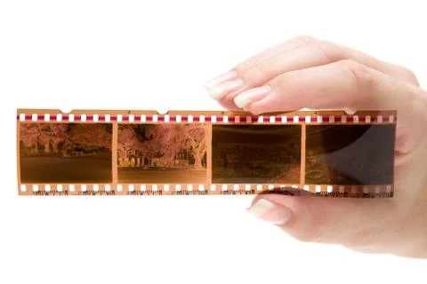Holding a Filmstrip Isolated on a White Background Stock Photos