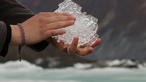Holding glacier ice in hand Video stock 79330632
