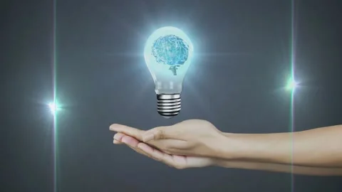 Holding glowing light bulb with brain animation over dark background Stock Footage 328235537