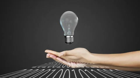 Holding glowing light bulb over binary code, symbolizing innovation and 스톡 동영상 304646107