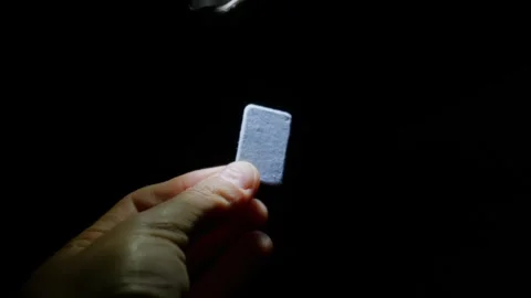 Holding Glowing Mosquito Mat Tablet Under Dark Night Flashlight Stock Footage 345170875