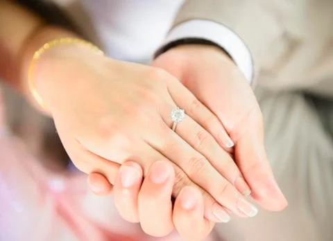 Holding hand Stock Photos