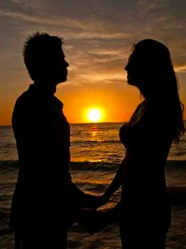 Holding Hands at the Beach Stock Photos
