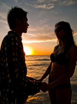 Holding Hands at the Beach Stock Photos